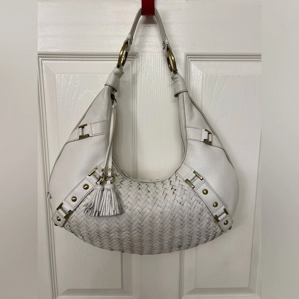 Cole Haan Woven Leather Hobo bag in Ivory with gold hardware and zipper tassels.